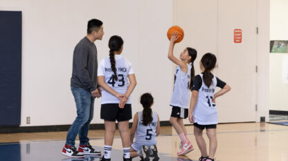 Group of youth playing basketball.