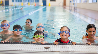 Four youth in a swimming pool.