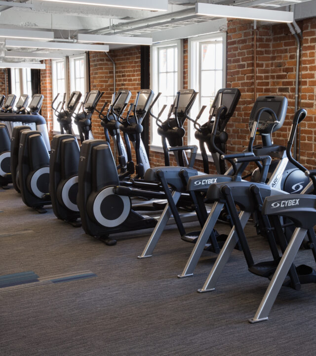 Row of exercise machines.