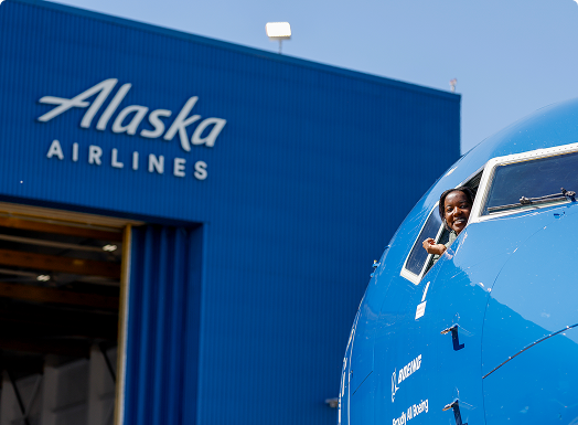 Alaska Airlines Airplane and hangar in the background