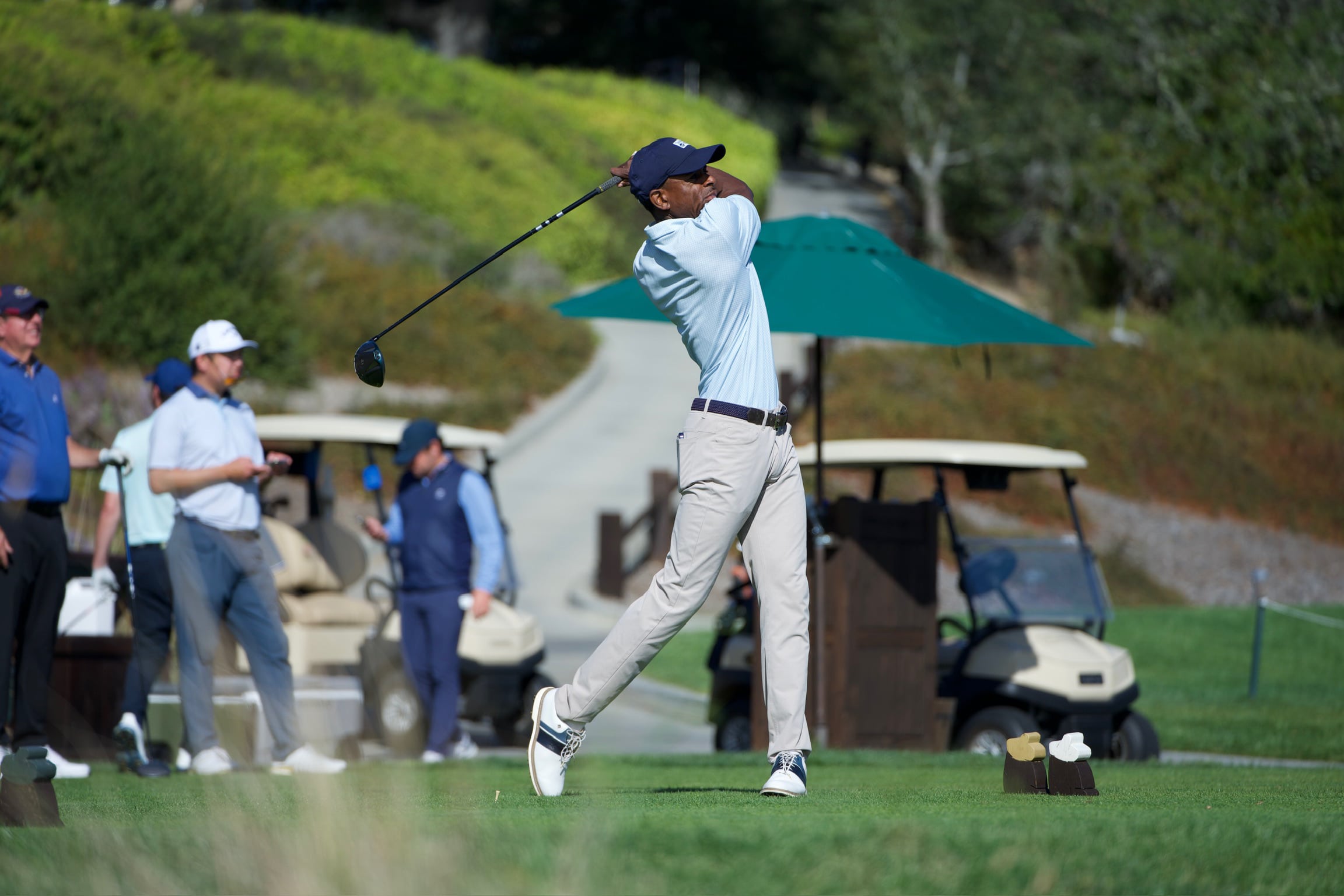 Golfer swings a golf club