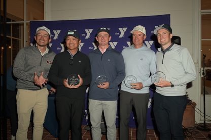 Five men in golf attire stand in front of a Bayview STEAM step-and-repeat backdrop, each holding a 1st place trophy.